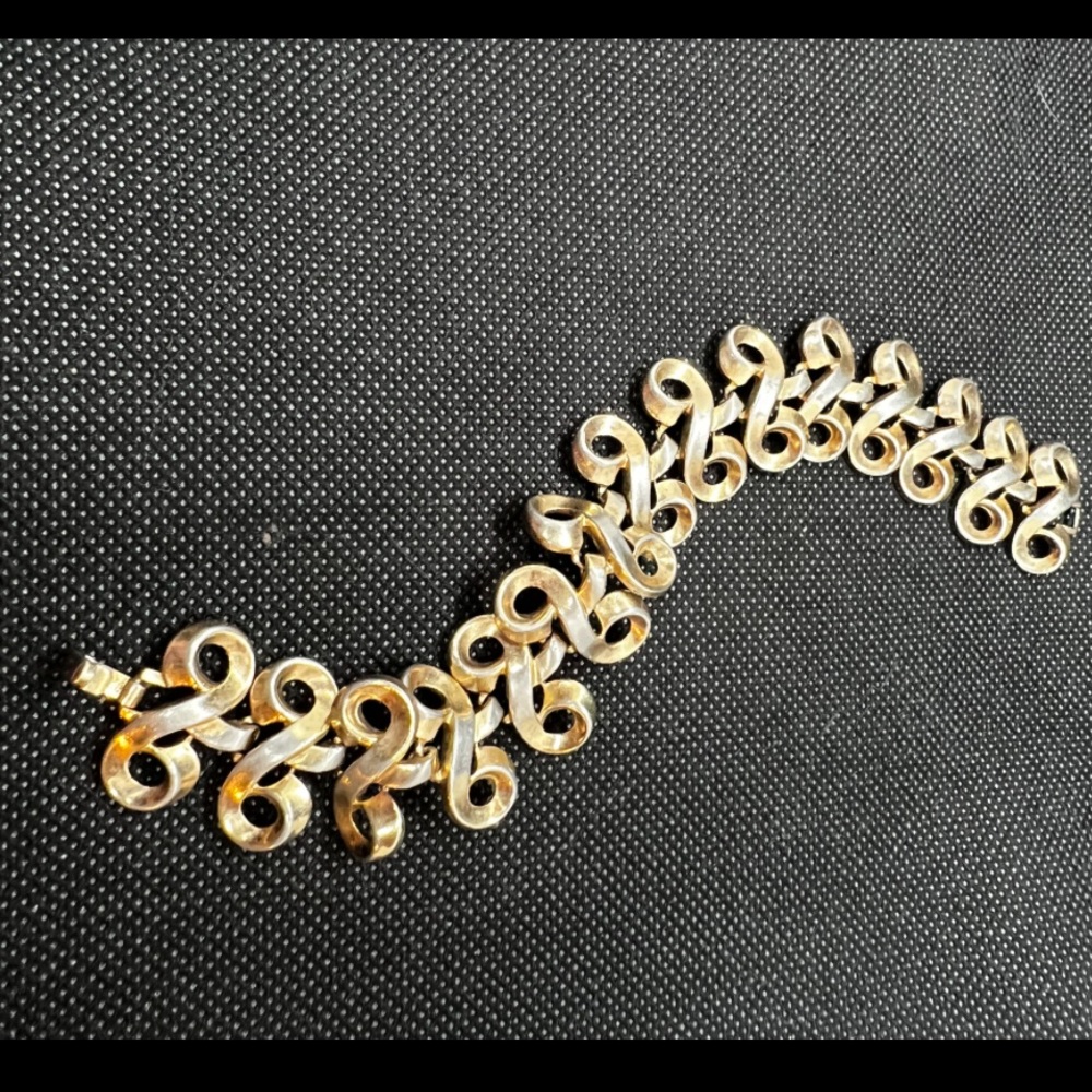1960s Trifari Gold Tone Swirl Bracelet Fold Over clasp closure